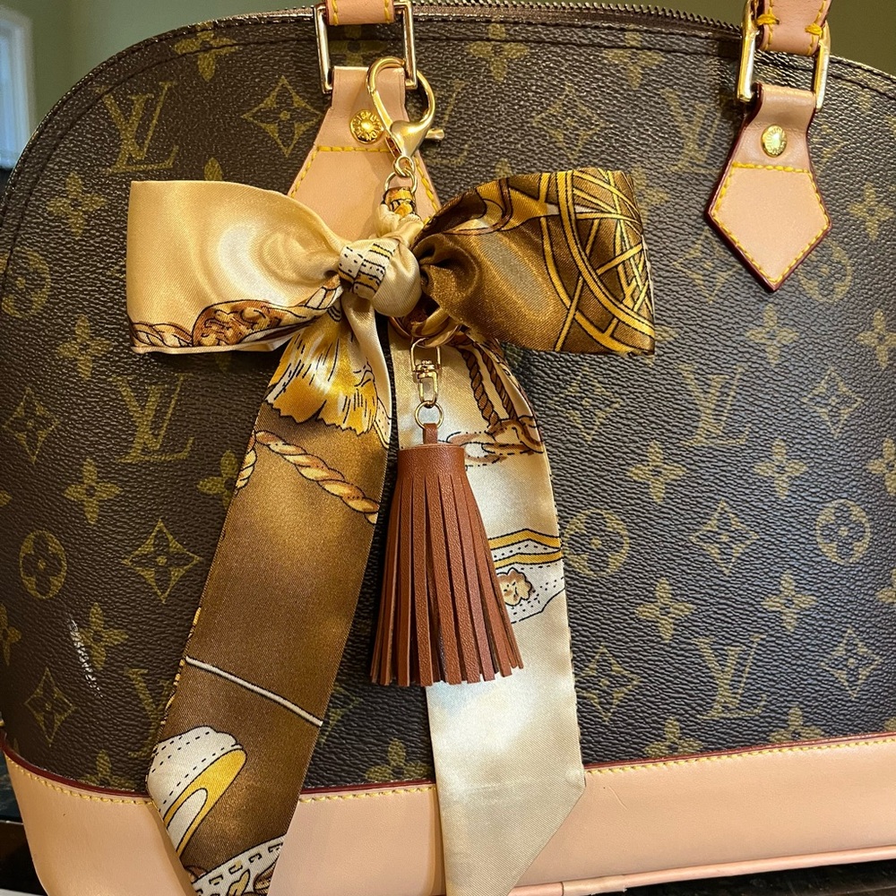 Purse scarf braided bow design brown tassel easy clip on bag. Gold brown ivory
